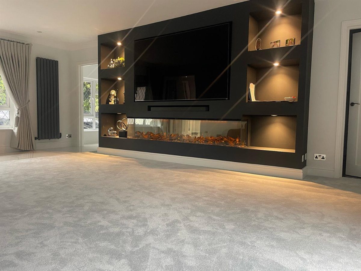 Light grey plush carpet in a modern media room with a built-in entertainment center.