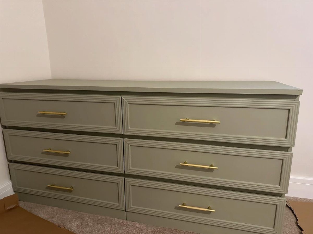 Sage green Alex drawers with gold handles and decorative rectangular trim on drawer fronts.